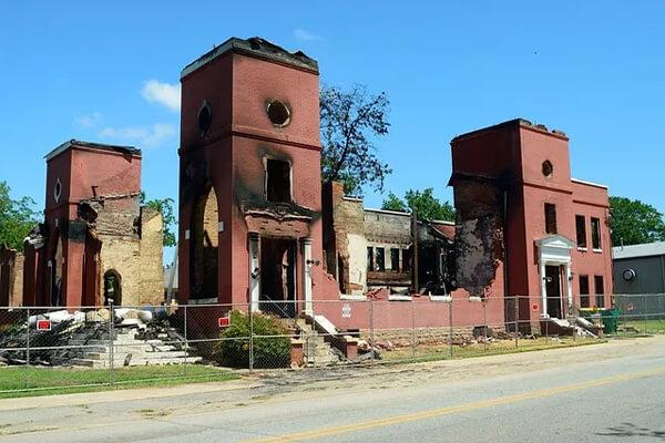 Fire damage restoration — commercial building exterior showing fire and smoke damage
